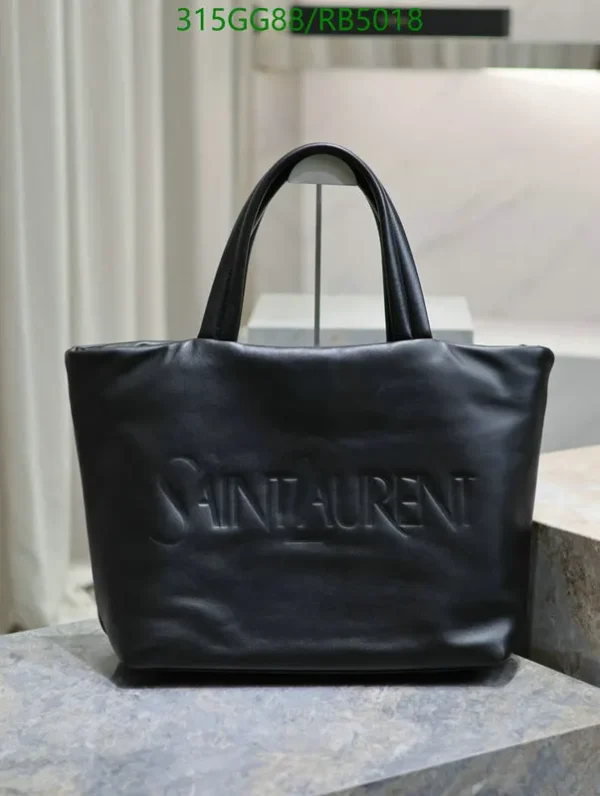 Saint Laurent Logo-Debossed Leather Tote Bag Mirror (1:1) – A luxury black lambskin handbag with a spacious interior, elegant design, and debossed logo detail.